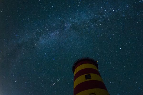 A falling star crosses the night sky behind the lighthouse in Pilsum, northwestern Germany. A falling star crosses the night sky behind the lighthouse in Pilsum, northwestern Germany. - Sputnik International