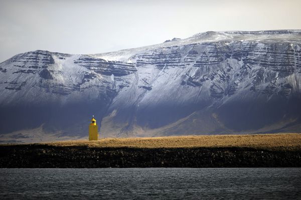 The sun shines on a yellow lighthouse outside Reykjavik harbour. The sun shines on a yellow lighthouse outside Reykjavik harbour. - Sputnik International