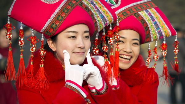 Hostesses pose for photos outside the Great Hall of the People during the opening session of the annual National People's Congress in Beijing Hostesses pose for photos outside the Great Hall of the People during the opening session of the annual National People's Congress in Beijing - Sputnik International