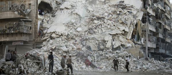 Members of the Syrian Civil Defence, known as the White Helmets, search for victims amid the rubble of a destroyed building following reported air strikes in the rebel-held Qatarji neighbourhood of the northern city of Aleppo, on October 17, 2016. Members of the Syrian Civil Defence, known as the White Helmets, search for victims amid the rubble of a destroyed building following reported air strikes in the rebel-held Qatarji neighbourhood of the northern city of Aleppo, on October 17, 2016. - Sputnik International