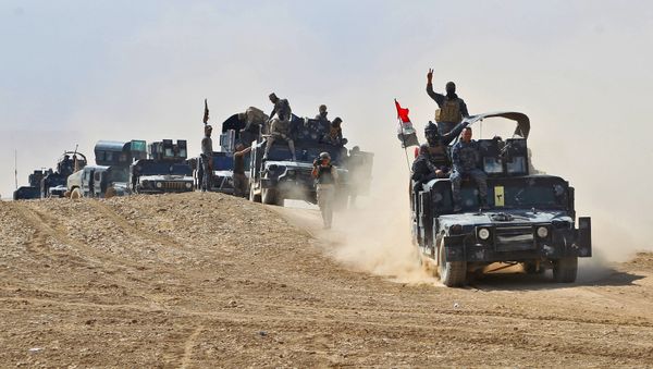 Iraqi forces hold a position near the village of Tall al-Tibah, some 30 kilometres south of Mosul during an operation against Islamic State (IS) group jihadists to retake the main hub city Iraqi forces hold a position near the village of Tall al-Tibah, some 30 kilometres south of Mosul during an operation against Islamic State (IS) group jihadists to retake the main hub city - Sputnik International