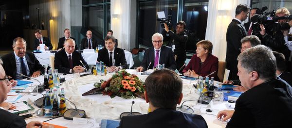 Russian President Vladimir Putin, German Chancellor Angela Merkel, background 2nd right, and Ukrainian President Petro Poroshenko, foreground right, during the Normandy format meeting between the leaders of Germany, Russia, Ukraine and France on settling the Ukrainian conflict, at the Paul Loebe Haus parliamentary building in Berlin, October 19, 2016. Background 3rd right: German Foreign Minister Frank-Walter Steinmeier. Background left: Russian Foreign Minister Sergei Lavrov. Background 3rd left: Russian Presidential Aide Vladislav Surkov. Russian President Vladimir Putin, German Chancellor Angela Merkel, background 2nd right, and Ukrainian President Petro Poroshenko, foreground right, during the Normandy format meeting between the leaders of Germany, Russia, Ukraine and France on settling the Ukrainian conflict, at the Paul Loebe Haus parliamentary building in Berlin, October 19, 2016. Background 3rd right: German Foreign Minister Frank-Walter Steinmeier. Background left: Russian Foreign Minister Sergei Lavrov. Background 3rd left: Russian Presidential Aide Vladislav Surkov. - Sputnik International