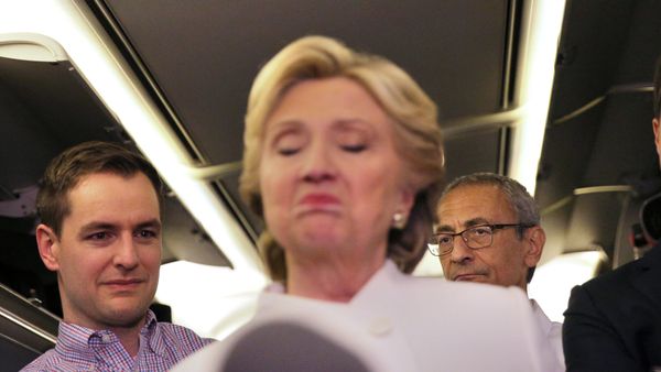 John Podesta (R), chairman of U.S. Democrat Hillary Clinton's presidential campaign, listens as she talks to the media inside of her campaign plane after the third and final 2016 presidential campaign debate in North Las Vegas, Nevada, U.S., October 19, 201 - Sputnik International