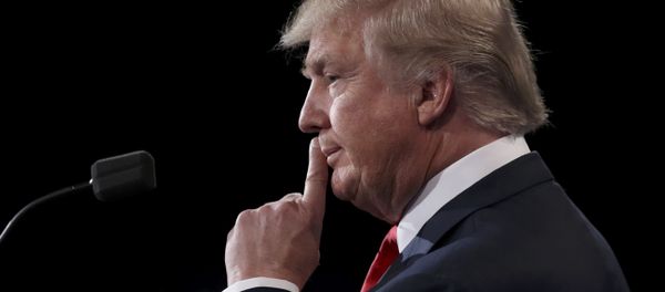Republican U.S. presidential nominee Donald Trump listens to Democratic U.S. presidential nominee Hillary Clinton during their third and final 2016 presidential campaign debate at UNLV in Las Vegas, Nevada, U.S., October 19, 2016 Republican U.S. presidential nominee Donald Trump listens to Democratic U.S. presidential nominee Hillary Clinton during their third and final 2016 presidential campaign debate at UNLV in Las Vegas, Nevada, U.S., October 19, 2016 - Sputnik International