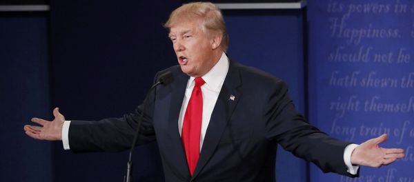Republican U.S. presidential nominee Donald Trumpspeaks as Democratic U.S. presidential nominee Hillary Clinton listens during their third and final 2016 presidential campaign debate at UNLV in Las Vegas, Nevada, U.S., October 19, 2016 - Sputnik International
