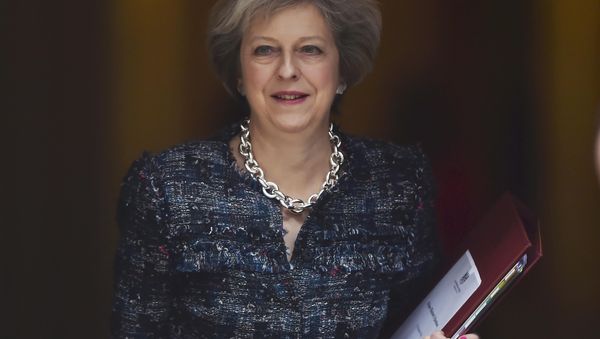 Britain's Prime Minister Theresa May leaves Number 10 Downing Street to attend Prime Minister's Questions at parliament in London, Britain October 19, 2016. Britain's Prime Minister Theresa May leaves Number 10 Downing Street to attend Prime Minister's Questions at parliament in London, Britain October 19, 2016. - Sputnik International