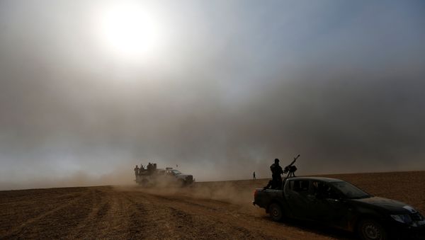 Members of the Iraqi security forces ride on military vehicles after the liberation of Khalidiya village from Islamic State militants south of Mosul, during an operation to attack Islamic State militants in Mosul, Iraq, October 20, 2016. Members of the Iraqi security forces ride on military vehicles after the liberation of Khalidiya village from Islamic State militants south of Mosul, during an operation to attack Islamic State militants in Mosul, Iraq, October 20, 2016. - Sputnik International