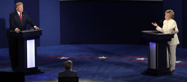 Democratic presidential nominee Hillary Clinton and Republican presidential nominee Donald Trump debate during the third presidential debate at UNLV in Las Vegas - Sputnik International