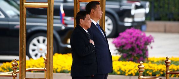 President of the Philippines Rodrigo Duterte (L) and Chinese President Xi Jinping attend a welcoming ceremony at the Great Hall of the People in Beijing, China, October 20, 2016. President of the Philippines Rodrigo Duterte (L) and Chinese President Xi Jinping attend a welcoming ceremony at the Great Hall of the People in Beijing, China, October 20, 2016. - Sputnik International