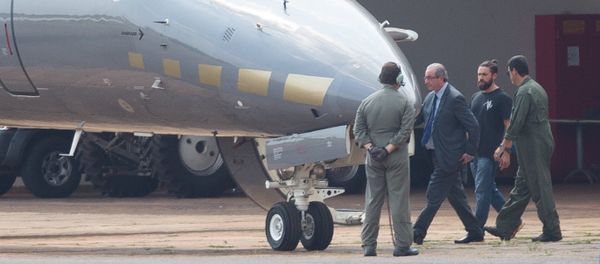 The former president of the Chamber of Deputies Eduardo Cunha, is escorted to a Federal Police's plane, departing to Curitiba where he should fulfill his provisionally arrest, which was issued this morning, at the Hangar of the Federal Police in Brasilia The former president of the Chamber of Deputies Eduardo Cunha, is escorted to a Federal Police's plane, departing to Curitiba where he should fulfill his provisionally arrest, which was issued this morning, at the Hangar of the Federal Police in Brasilia - Sputnik International
