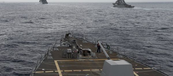 the guided missile destroyer USS Decatur, right, pulling into position behind the Military Sealift Command USNS Matthew Perry, during a replenishment-at-sea, seen from the bridge of the guided-missile destroyer USS Spruance, in the South China Sea. the guided missile destroyer USS Decatur, right, pulling into position behind the Military Sealift Command USNS Matthew Perry, during a replenishment-at-sea, seen from the bridge of the guided-missile destroyer USS Spruance, in the South China Sea. - Sputnik International