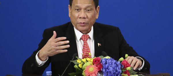 Philippine President Rodrigo Duterte delivers a speech during the Philippines-China Trade and Investment Forum at the Great Hall of the People in Beijing - Sputnik International