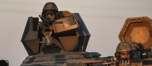 Turkish soldiers stand in a Turkish army tank driving back to Turkey from the Syrian-Turkish border town of Jarabulus in the Turkish-Syrian border town of Karkamis - Sputnik International