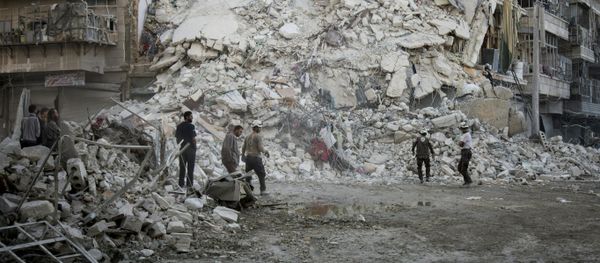 Members of the Syrian Civil Defence, known as the White Helmets, search for victims amid the rubble of a destroyed building following reported air strikes in the rebel-held Qatarji neighbourhood of the northern city of Aleppo, on October 17, 2016 Members of the Syrian Civil Defence, known as the White Helmets, search for victims amid the rubble of a destroyed building following reported air strikes in the rebel-held Qatarji neighbourhood of the northern city of Aleppo, on October 17, 2016 - Sputnik International