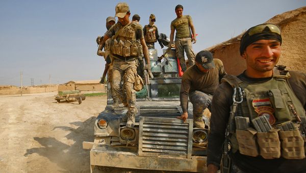 Iraqi forces enter the village of al-Khuwayn, south of Mosul, after recapturing the village from Islamic State (IS) group jihadists on October 23, 2016 Iraqi forces enter the village of al-Khuwayn, south of Mosul, after recapturing the village from Islamic State (IS) group jihadists on October 23, 2016 - Sputnik International