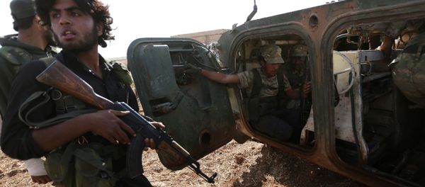 Rebel fighters ride a military vehicle on the outskirts of Syria Democratic Forces (SDF) controlled Tell Rifaat town, northern Aleppo province, Syria October 22, 2016 - Sputnik International