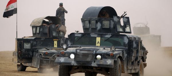 Iraqi forces gather in the al-Shura area, south of Mosul, on October 24, 2016, during an operation to retake the main hub city from the Islamic State (IS) group jihadists Iraqi forces gather in the al-Shura area, south of Mosul, on October 24, 2016, during an operation to retake the main hub city from the Islamic State (IS) group jihadists - Sputnik International
