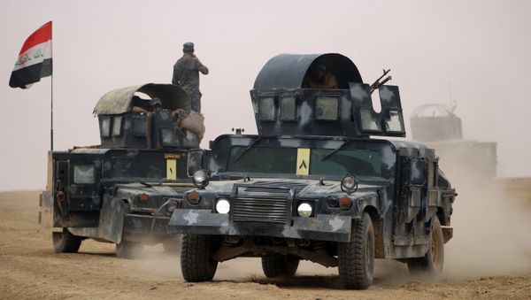 Iraqi forces gather in the al-Shura area, south of Mosul, on October 24, 2016, during an operation to retake the main hub city from the Islamic State (IS) group jihadists Iraqi forces gather in the al-Shura area, south of Mosul, on October 24, 2016, during an operation to retake the main hub city from the Islamic State (IS) group jihadists - Sputnik International