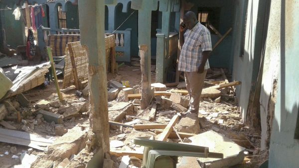 A man stands amid the debris at the scene of an attack in the town of Mandera, Kenya, near the border with Somalia, Tuesday, Oct. 25, 2016 A man stands amid the debris at the scene of an attack in the town of Mandera, Kenya, near the border with Somalia, Tuesday, Oct. 25, 2016 - Sputnik International