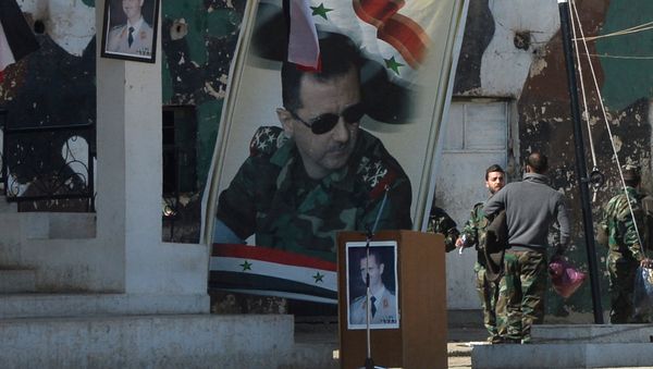 Banners with the portrait of Syrian President Bashar al-Assad at a self-defense fighters' training center near Damascus Banners with the portrait of Syrian President Bashar al-Assad at a self-defense fighters' training center near Damascus - Sputnik International