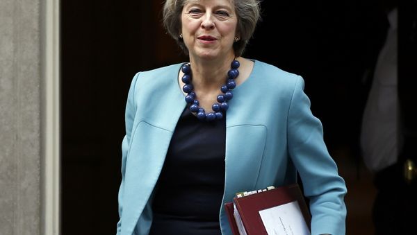 Britain's Prime Minister, Theresa May, leaves 10 Downing Street to attend Prime Minister's Questions in the House of Commons, in London, Britain October 26, 2016. Britain's Prime Minister, Theresa May, leaves 10 Downing Street to attend Prime Minister's Questions in the House of Commons, in London, Britain October 26, 2016. - Sputnik International
