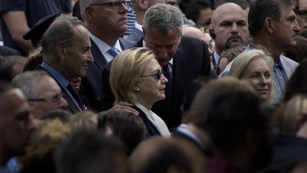 New York City Mayor Bill de Blasio speaks to US Democratic presidential nominee Hillary Clinton during a memorial service at the National 9/11 Memorial September 11, 2016 in New York New York City Mayor Bill de Blasio speaks to US Democratic presidential nominee Hillary Clinton during a memorial service at the National 9/11 Memorial September 11, 2016 in New York - Sputnik International