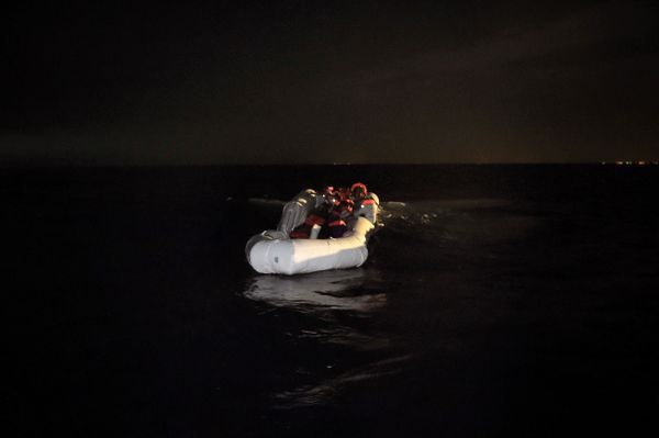 Refugees and migrants wait to be rescued from their sinking rubber boat some eight nautical miles off Libya's Mediterranean coastline on October 12, 2016 Refugees and migrants wait to be rescued from their sinking rubber boat some eight nautical miles off Libya's Mediterranean coastline on October 12, 2016 - Sputnik International