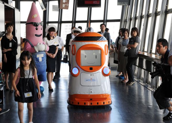 Guide robot Tawabo, produced by Japan's security company Alsok, is seen among people at the Tokyo Tower observation floor in Tokyo on August 1, 2012. The 1.6 meter tall robot weighs 200 kilos and can provide information in English, Chinese, Korean and Japanese vocally and on a digital display. Guide robot Tawabo, produced by Japan's security company Alsok, is seen among people at the Tokyo Tower observation floor in Tokyo on August 1, 2012. The 1.6 meter tall robot weighs 200 kilos and can provide information in English, Chinese, Korean and Japanese vocally and on a digital display. - Sputnik International
