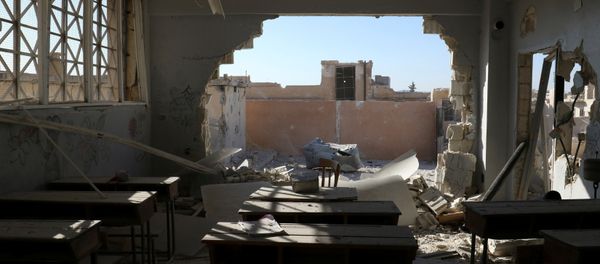 A damaged classroom is pictured after shelling in the rebel held town of Hass, south of Idlib province, Syria A damaged classroom is pictured after shelling in the rebel held town of Hass, south of Idlib province, Syria - Sputnik International