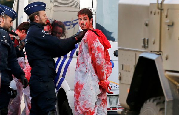 A demonstrator with red paint is detained by police officers during a protest against the Comprehensive Economic and Trade Agreement (CETA), a EU-Canada free trade agreement, outside the European Council in Brussels, Belgium, October 30, 2016. A demonstrator with red paint is detained by police officers during a protest against the Comprehensive Economic and Trade Agreement (CETA), a EU-Canada free trade agreement, outside the European Council in Brussels, Belgium, October 30, 2016. - Sputnik International