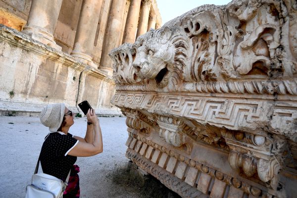 A visitor takes pictures of a bas-relief with heads of lions from the roof of the Temple of Jupiter in a temple complex of Baalbek, Lebanon A visitor takes pictures of a bas-relief with heads of lions from the roof of the Temple of Jupiter in a temple complex of Baalbek, Lebanon - Sputnik International