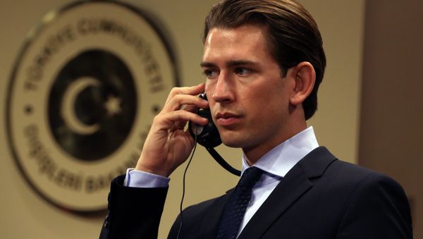 Austria's Foreign Minister Sebastian Kurz listens to his Turkish counterpart Feridun Sinirlioglu after talks in Ankara, Turkey, Saturday, Sept. 19, 2015 - Sputnik International