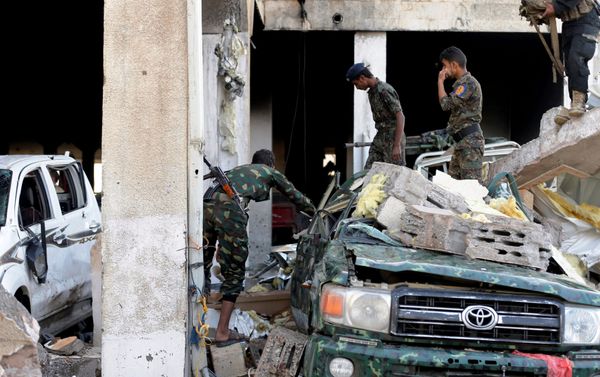 Men inspect the site of an airstrike which witnesses said was by Saudi-led coalition aircraft on mourners at a hall where a wake for the father of Jalal al-Roweishan, the interior minister in the Houthi-dominated Yemeni government, was being held, in Sanaa, Yemen October 8, 2016. Men inspect the site of an airstrike which witnesses said was by Saudi-led coalition aircraft on mourners at a hall where a wake for the father of Jalal al-Roweishan, the interior minister in the Houthi-dominated Yemeni government, was being held, in Sanaa, Yemen October 8, 2016. - Sputnik International