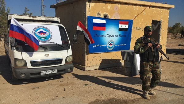 Law enforcement officers in a humanitarian corridor for civilians and militants along the Castello Road in northern Aleppo, Syria Law enforcement officers in a humanitarian corridor for civilians and militants along the Castello Road in northern Aleppo, Syria - Sputnik International