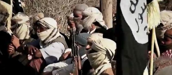 An image grab taken on April 16, 2014 from a video released on March 29, 2014 by Al-Malahem Media, the media arm of Al-Qaeda in the Arabian Peninsula (AQAP), allegedly shows AQAP jihadists listening to their chief Nasser al-Wuhayshi at an undisclosed location in Yemen An image grab taken on April 16, 2014 from a video released on March 29, 2014 by Al-Malahem Media, the media arm of Al-Qaeda in the Arabian Peninsula (AQAP), allegedly shows AQAP jihadists listening to their chief Nasser al-Wuhayshi at an undisclosed location in Yemen - Sputnik International