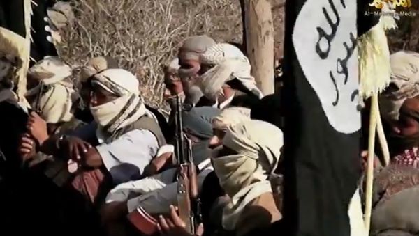 An image grab taken on April 16, 2014 from a video released on March 29, 2014 by Al-Malahem Media, the media arm of Al-Qaeda in the Arabian Peninsula (AQAP), allegedly shows AQAP jihadists listening to their chief Nasser al-Wuhayshi at an undisclosed location in Yemen An image grab taken on April 16, 2014 from a video released on March 29, 2014 by Al-Malahem Media, the media arm of Al-Qaeda in the Arabian Peninsula (AQAP), allegedly shows AQAP jihadists listening to their chief Nasser al-Wuhayshi at an undisclosed location in Yemen - Sputnik International