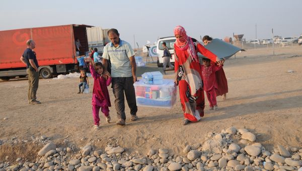 In this photo residents of Mosul and the nearby villages are seen being accomodated in the Hazir refugee camp In this photo residents of Mosul and the nearby villages are seen being accomodated in the Hazir refugee camp - Sputnik International