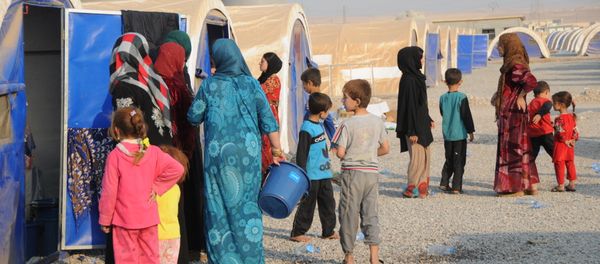 In this photo residents of Mosul and the nearby villages are seen being accomodated in the Hazir refugee camp In this photo residents of Mosul and the nearby villages are seen being accomodated in the Hazir refugee camp - Sputnik International