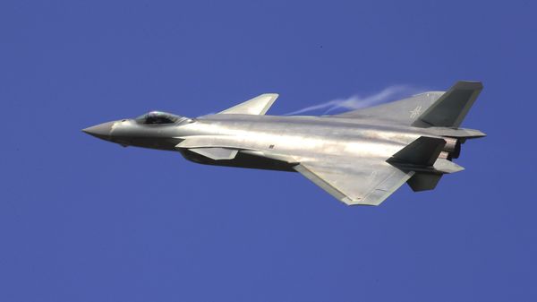 In this photo provided by China's Xinhua News Agency, the J-20 stealth fighter jet flies at the China International Aviation and Aerospace Exhibition in Zhuhai on Tuesday, 1 November 2016. - Sputnik International