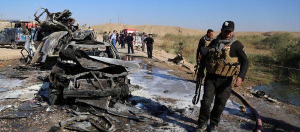 Iraqi security forces inspect the site of a bomb attack in Tikrit, Iraq, November 6, 2016 Iraqi security forces inspect the site of a bomb attack in Tikrit, Iraq, November 6, 2016 - Sputnik International
