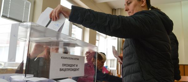 A voter casts her vote at a polling station in Sofia during Bulgarian presidential elections and a national referendum on the electoral code A voter casts her vote at a polling station in Sofia during Bulgarian presidential elections and a national referendum on the electoral code - Sputnik International