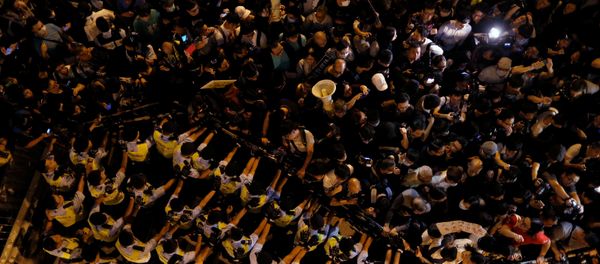 Police stop demonstrators as they protest against what they call Beijing's interference over local politics and the rule of law, a day before China's parliament is expected to announce their interpretation of the Basic Law in light of two pro-independence lawmakers' oath-taking controversy in Hong Kong, China November 6, 2016. Police stop demonstrators as they protest against what they call Beijing's interference over local politics and the rule of law, a day before China's parliament is expected to announce their interpretation of the Basic Law in light of two pro-independence lawmakers' oath-taking controversy in Hong Kong, China November 6, 2016. - Sputnik International