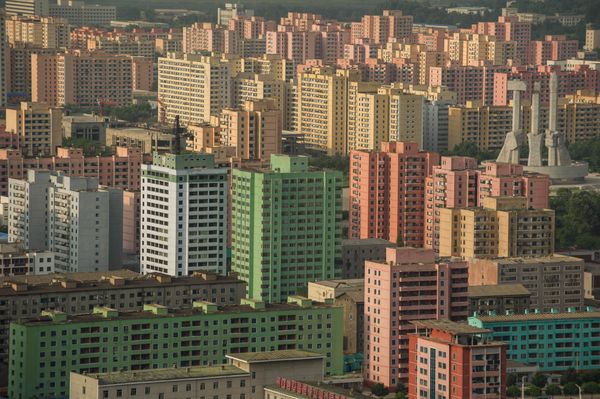 A photo taken on July 17, 2016 shows apartment buildings and the Monument to the Founding of the Workers Party (centre R) amongst the Pyongyang skyline, seen from a viewing deck of the landmark Tower of the Juche Idea. - Sputnik International