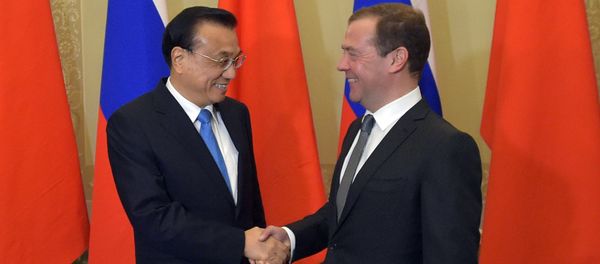 Russian Prime Minister Dmitry Medvedev and Chinese State Council Premier Li Keqiang during the 21st regular meeting between Russian and Chinese government heads in St. Petersburg - Sputnik International