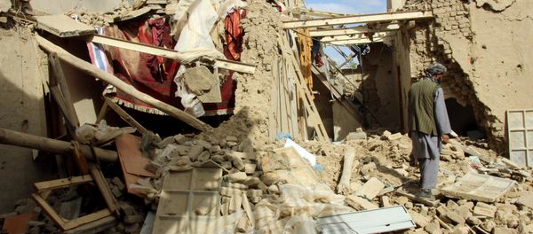 An Afghan man inspects a house destroyed during an air strike called in to protect Afghan and U.S. forces during a raid on suspected Taliban militants, in Kunduz, Afghanistan An Afghan man inspects a house destroyed during an air strike called in to protect Afghan and U.S. forces during a raid on suspected Taliban militants, in Kunduz, Afghanistan - Sputnik International