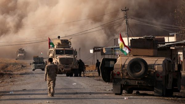 Smoke rises during clashes between Peshmerga forces and Islamic State militants in the town of Bashiqa, east of Mosul, during an operation to attack Islamic State militants in Mosul, Iraq, November 7, 2016 Smoke rises during clashes between Peshmerga forces and Islamic State militants in the town of Bashiqa, east of Mosul, during an operation to attack Islamic State militants in Mosul, Iraq, November 7, 2016 - Sputnik International