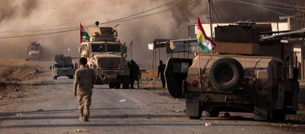 Smoke rises during clashes between Peshmerga forces and Islamic State militants in the town of Bashiqa, east of Mosul, during an operation to attack Islamic State militants in Mosul, Iraq, November 7, 2016 Smoke rises during clashes between Peshmerga forces and Islamic State militants in the town of Bashiqa, east of Mosul, during an operation to attack Islamic State militants in Mosul, Iraq, November 7, 2016 - Sputnik International