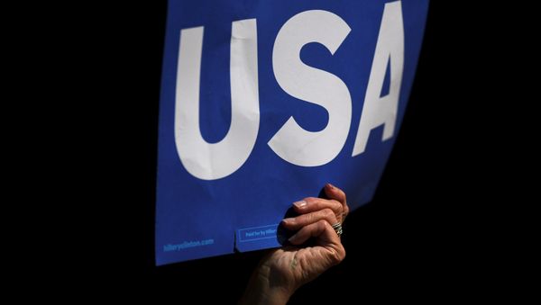 Supporters wave USA posters while US President Barack Obama speaks during a rally in support of US Democratic presidential candidate Hillary Clinton in front of Independence Hall during their final rally on the eve of election day in Philadelphia, Pennsylvania November 7, 2016. Supporters wave USA posters while US President Barack Obama speaks during a rally in support of US Democratic presidential candidate Hillary Clinton in front of Independence Hall during their final rally on the eve of election day in Philadelphia, Pennsylvania November 7, 2016. - Sputnik International