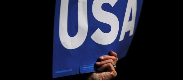 Supporters wave USA posters while US President Barack Obama speaks during a rally in support of US Democratic presidential candidate Hillary Clinton in front of Independence Hall during their final rally on the eve of election day in Philadelphia, Pennsylvania November 7, 2016. - Sputnik International