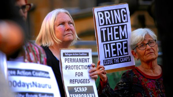 Refugee advocates hold placards and banners during a protest in central Sydney, Australia, October 5, 2016 Refugee advocates hold placards and banners during a protest in central Sydney, Australia, October 5, 2016 - Sputnik International